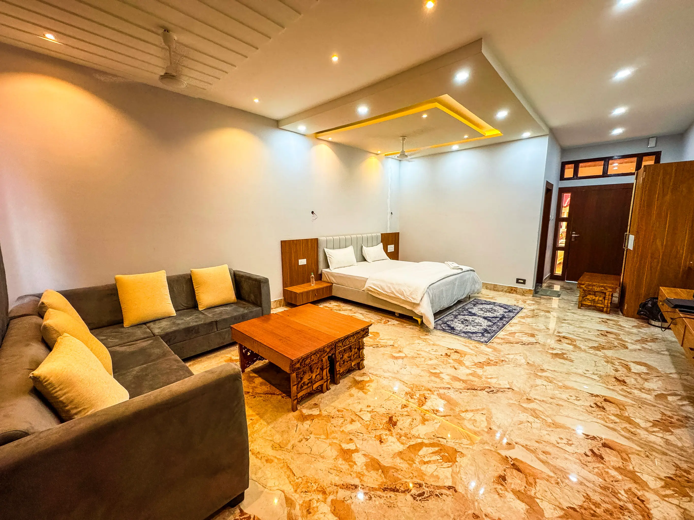 Luxury suite room with king-size bed and red pillows